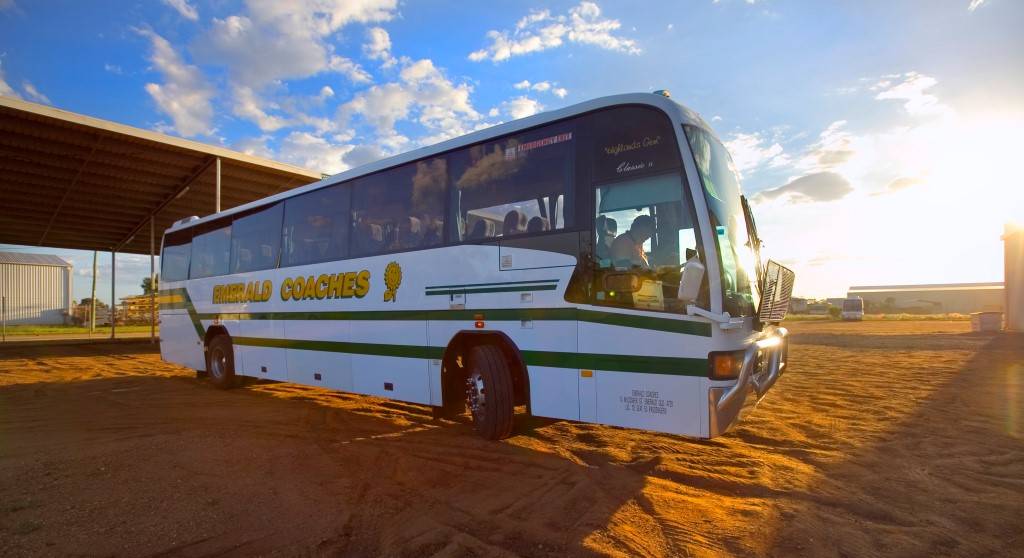 emerald coach bus at sunset